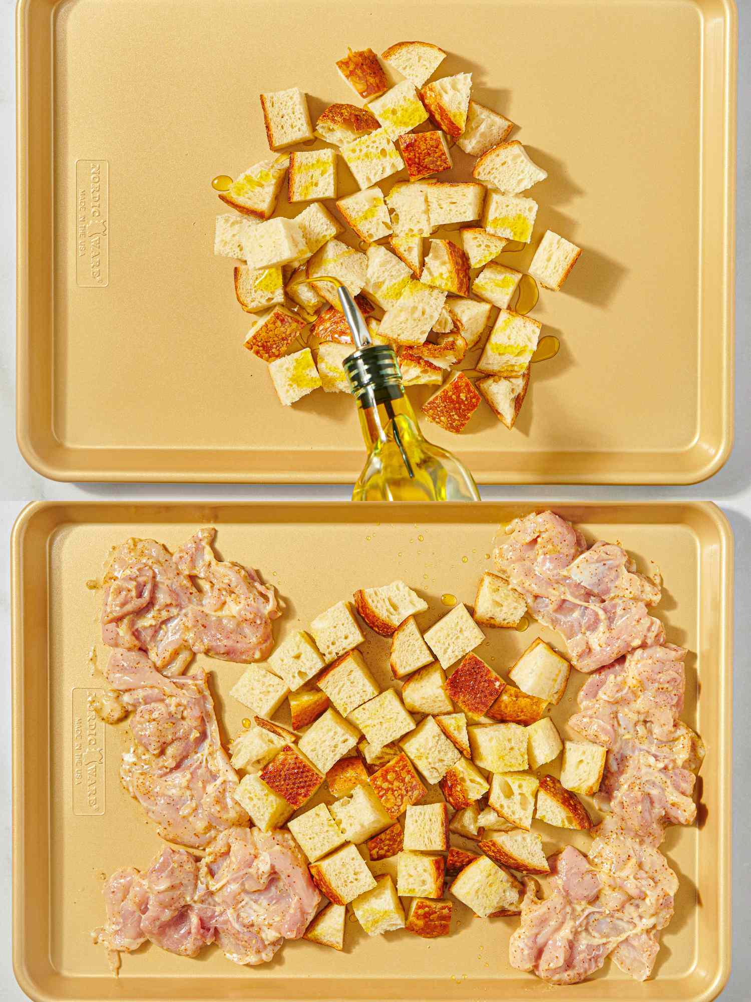Two baking sheets one with cubed bread and one with bread and raw chicken thighs ready for preparation