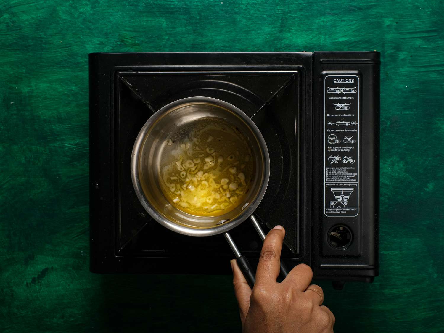 Heating butter and garlic in saucepan 