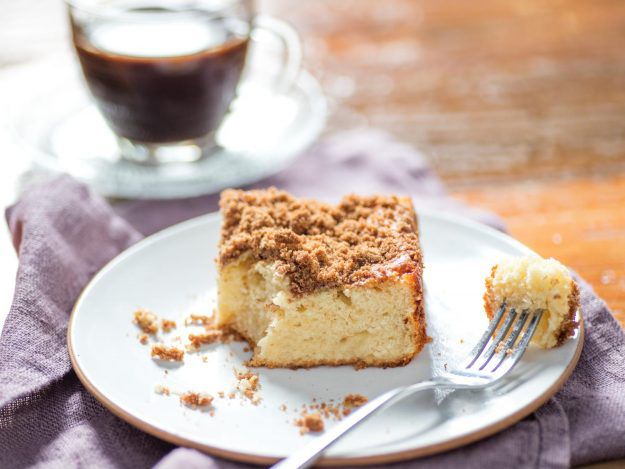 Slice of coffee cake on a plate with a fork