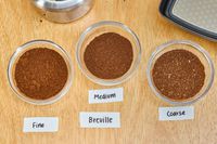 Coffee beans ground on three different settings in the Breville The Smart Grinder Pro