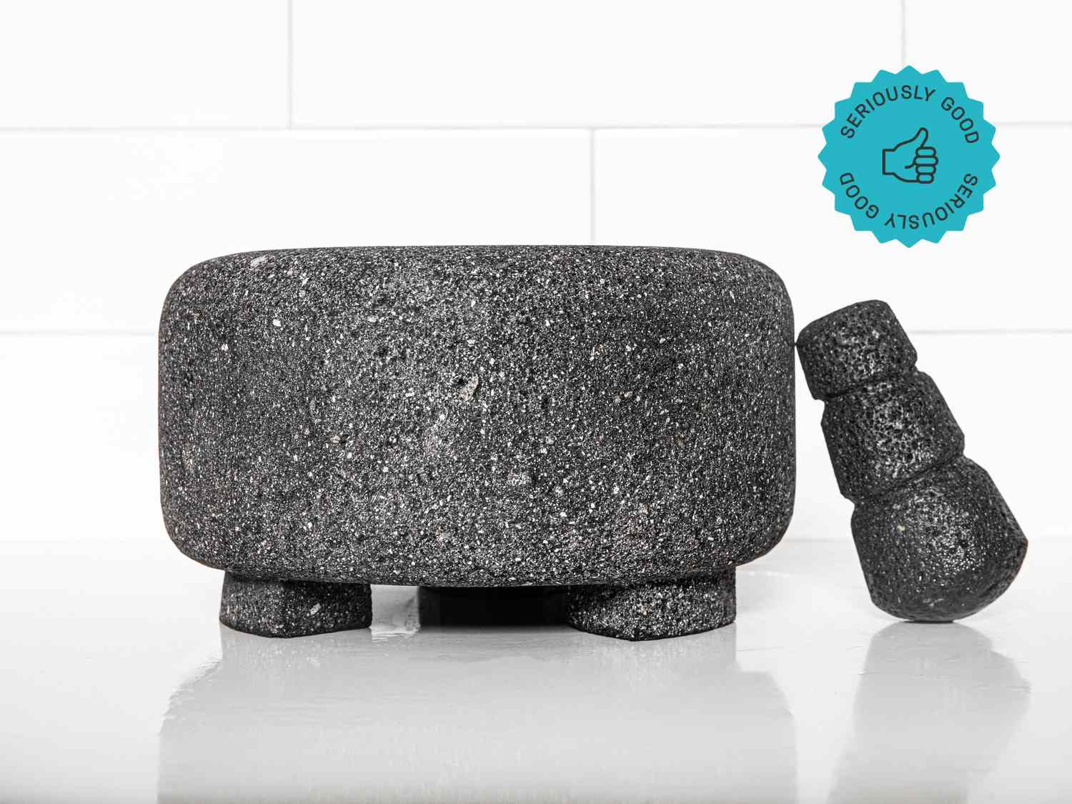 The Masienda Molcajete on a white countertop. A graphic in the upper right corner states that it is a "Seriously Good" product.
