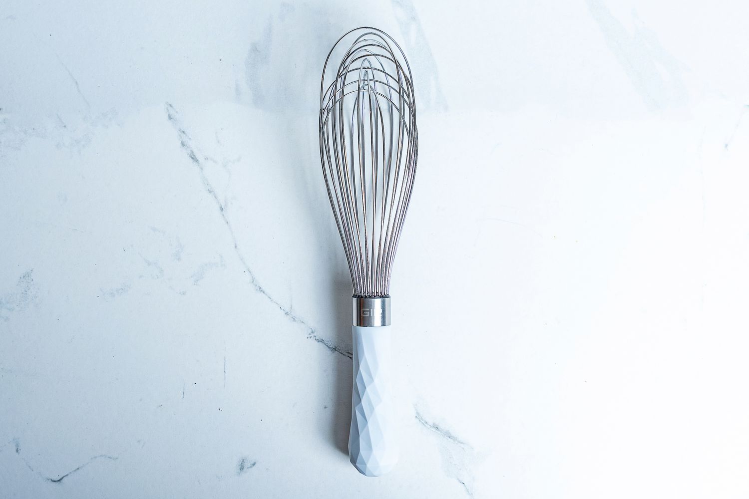 GIR Ultimate Whisk on a marbled surface