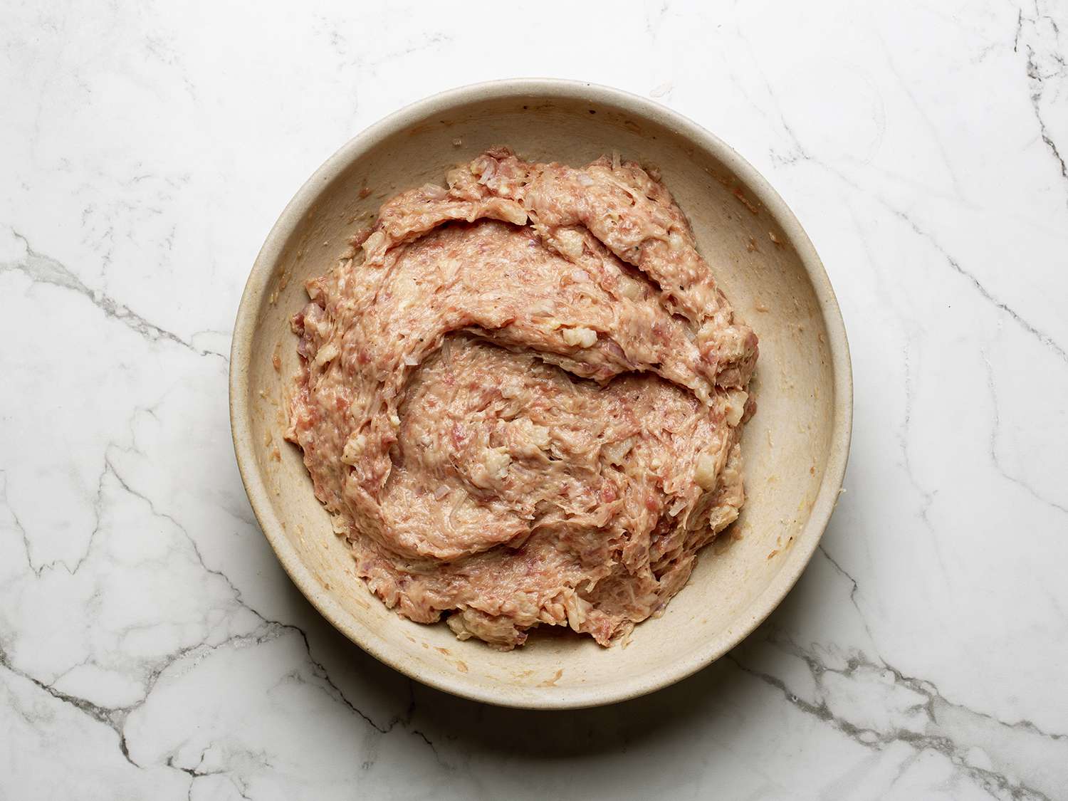 Raw nem lui mixture after mixing in a bowl