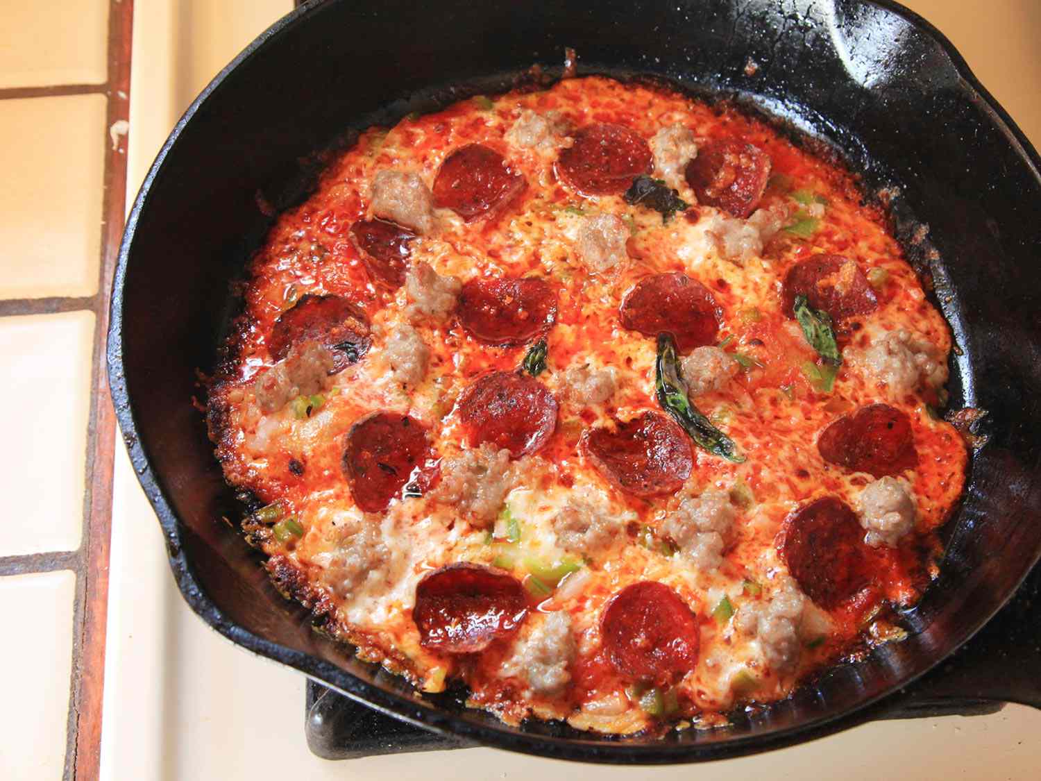 A "supreme" tortilla pizza, fresh from the oven.