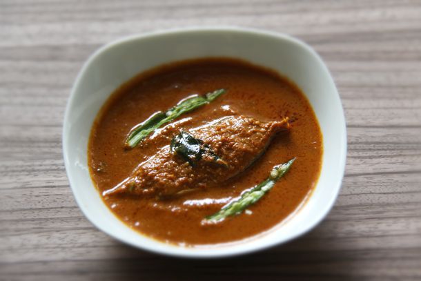 Goan fish curry, served in a small white bowl.