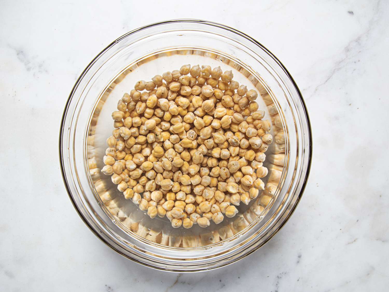 A bowl of chickpeas in water 