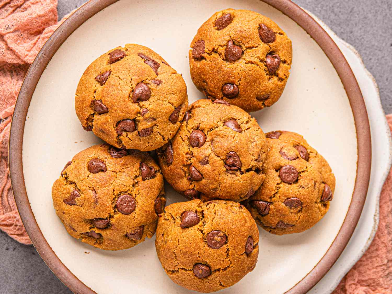 A plate of chocolate chip cookies arranged in a circle