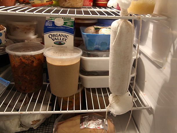 The torchon, suspended from the top shelf in a refrigerator.