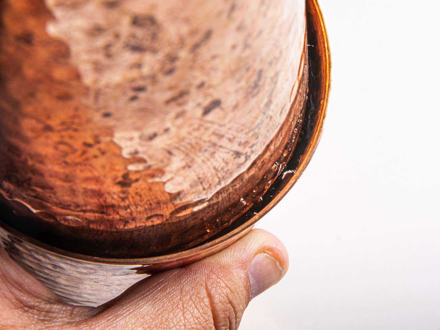 An up close look at the broken seal of a copper Boston shaker