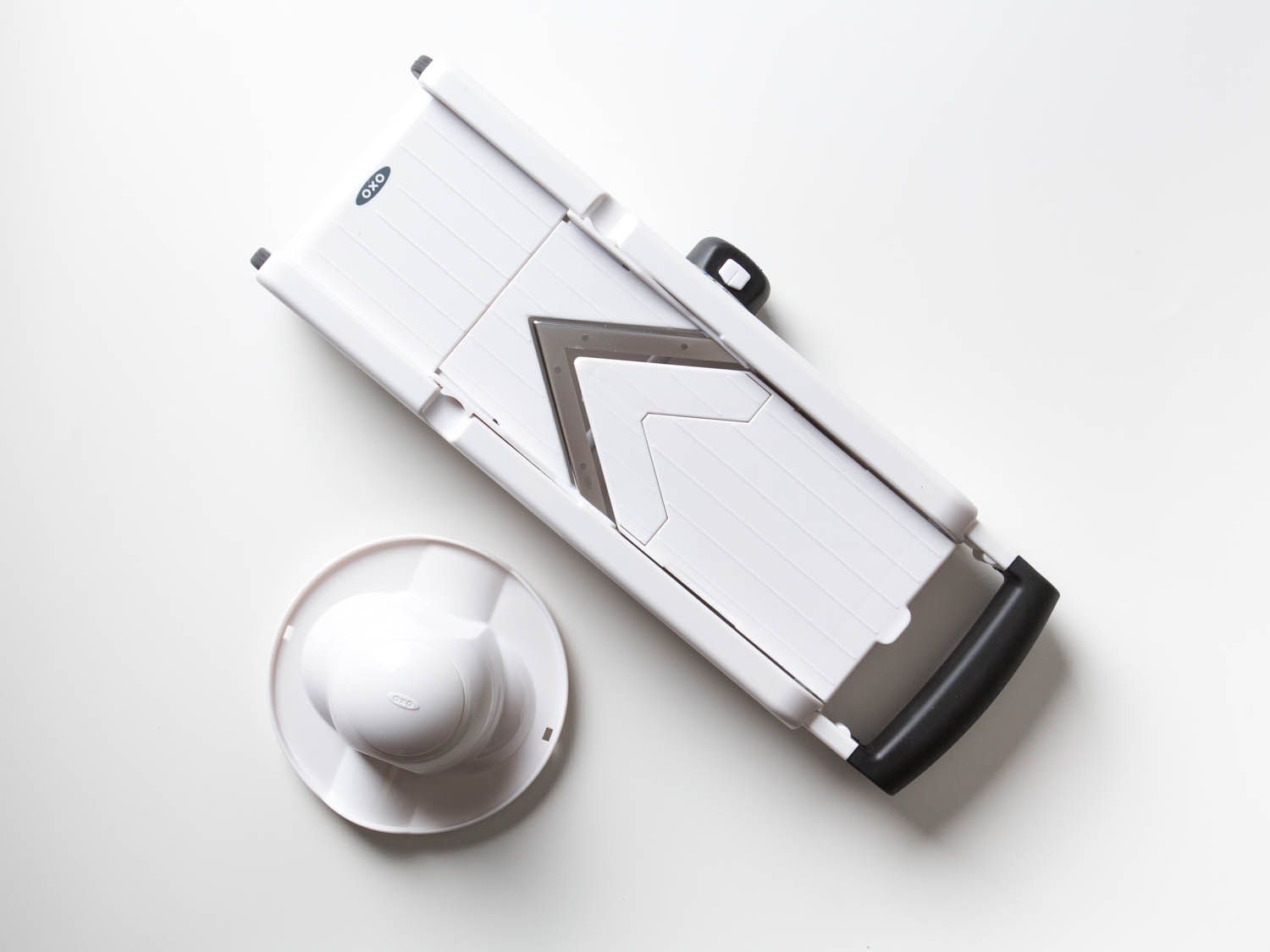 The OXO mandoline on white surface