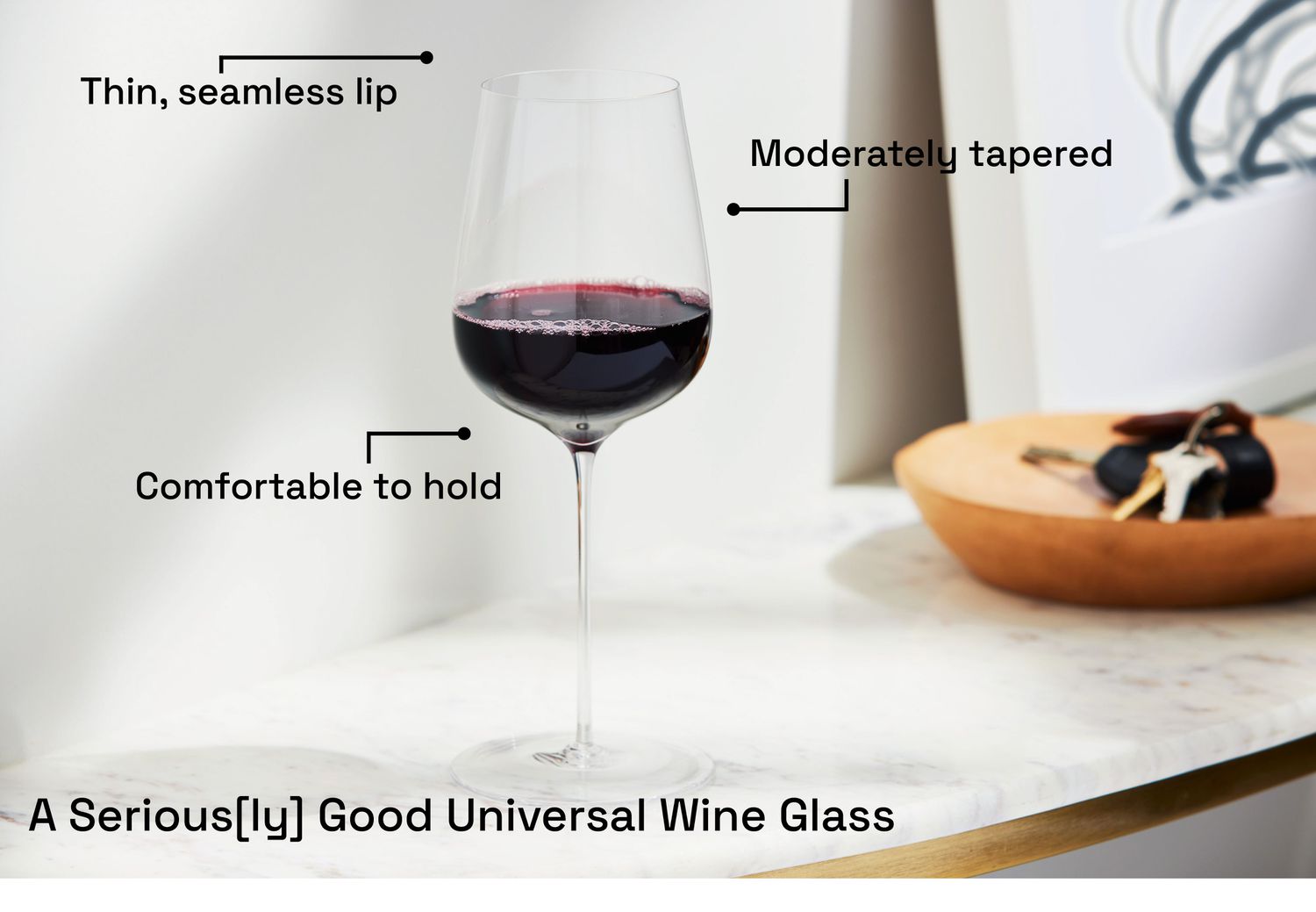 A wine glass on a marble table 