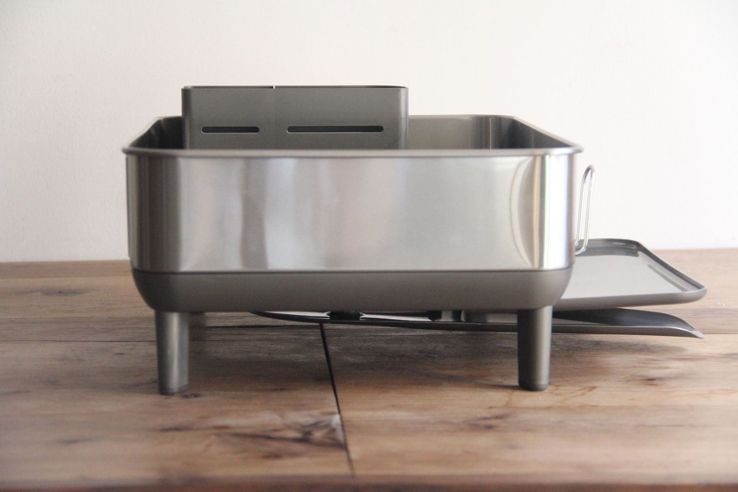 simplehuman dish rack on wooden countertop
