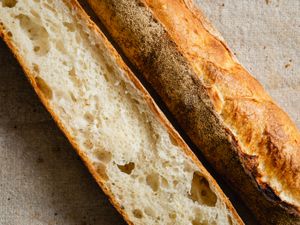 A sliced baguette showing the crust and the texture of the interior