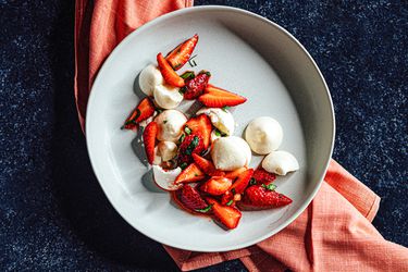 Overhead view of aquafaba meringue cookies with strawberry compote