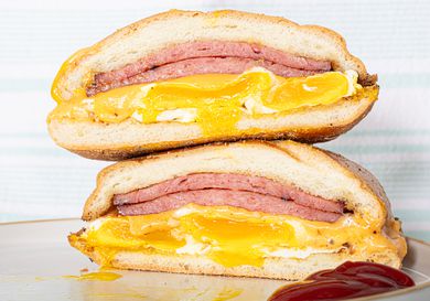 Stacked pork roll halved.