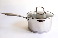 A pot from the Cuisinart Professional Series Cookware 11 Piece Set on a white surface