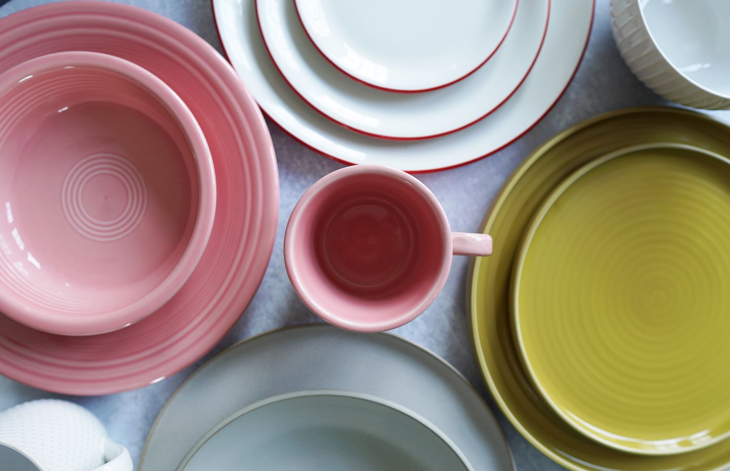 Closeup of several dinnerware sets on a table