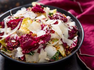 A hearty salad of radicchio, endive, and anchovies topped with shaved Parmigiano-Reggiano.