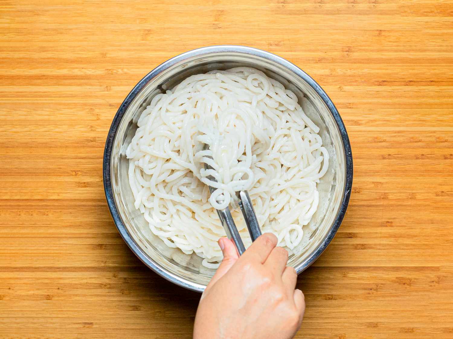 Overhead view of cooked noodles in a bowl