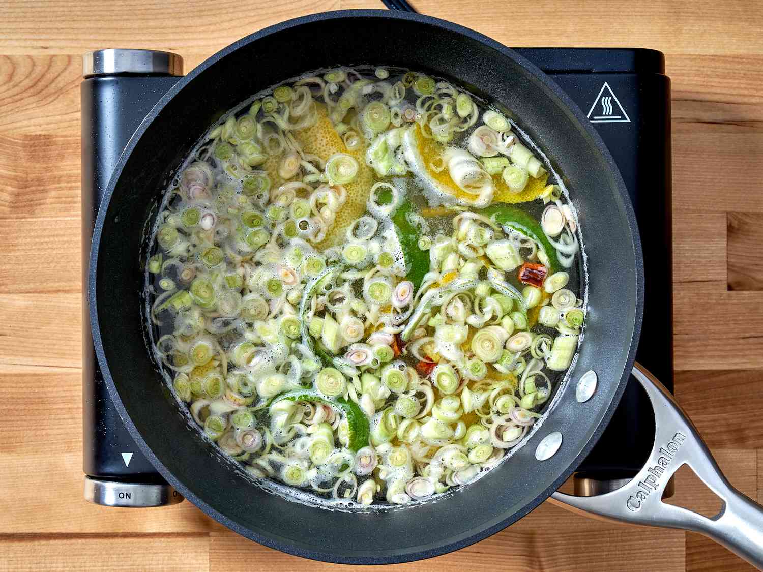 Zested lemon and lime, along with their juices in a medium saucepan, along with water, cinchona bark, citric acid powder, lemongrass, and sugar. 