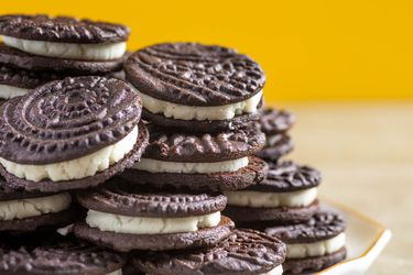 A stack of homemade Oreos on a plate. 