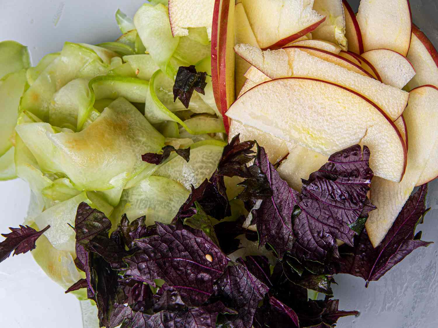 Chayote slices, apple slices, and red shiso