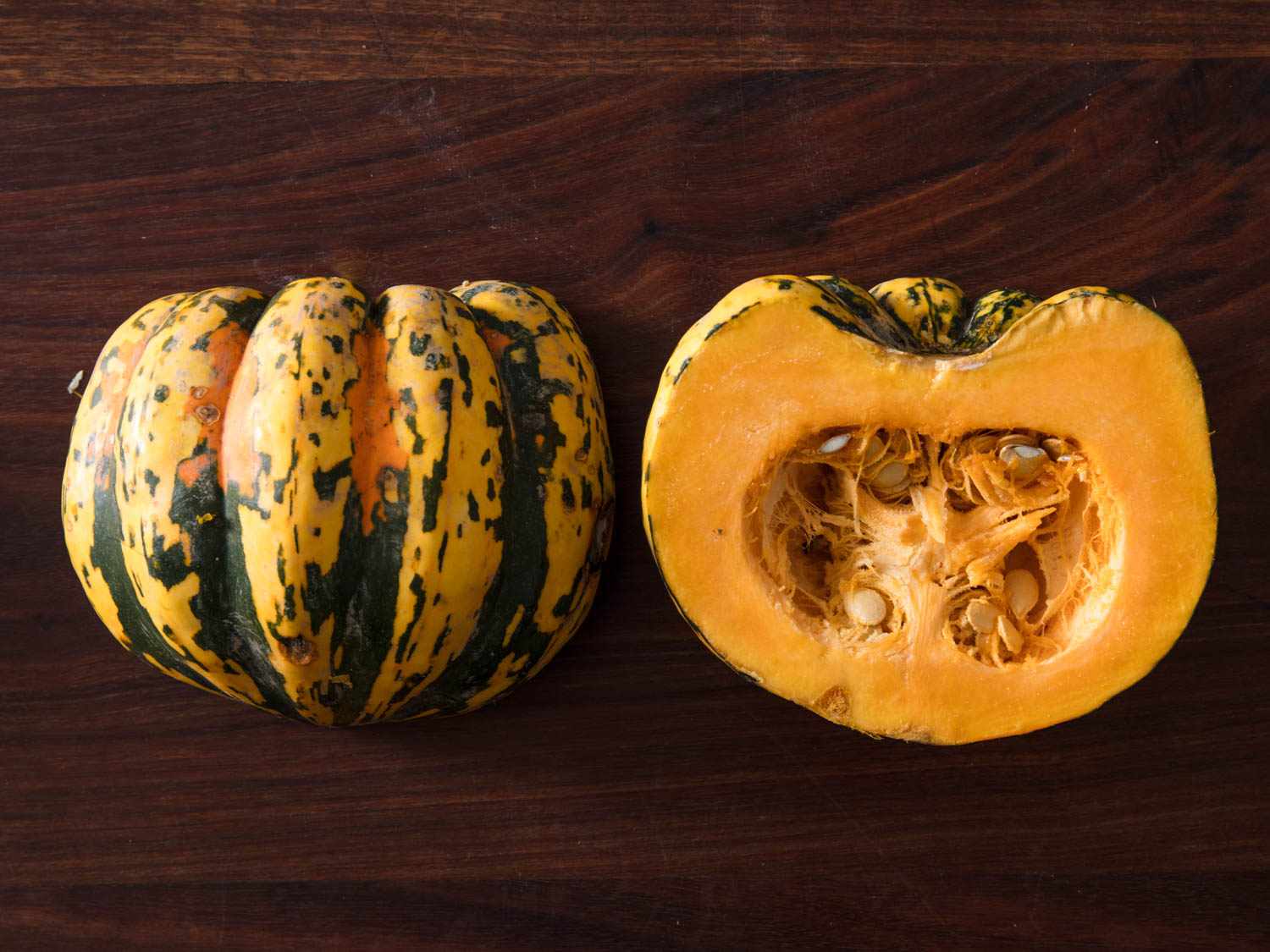 Carnival squash halved and displayed cut side down and cut side up