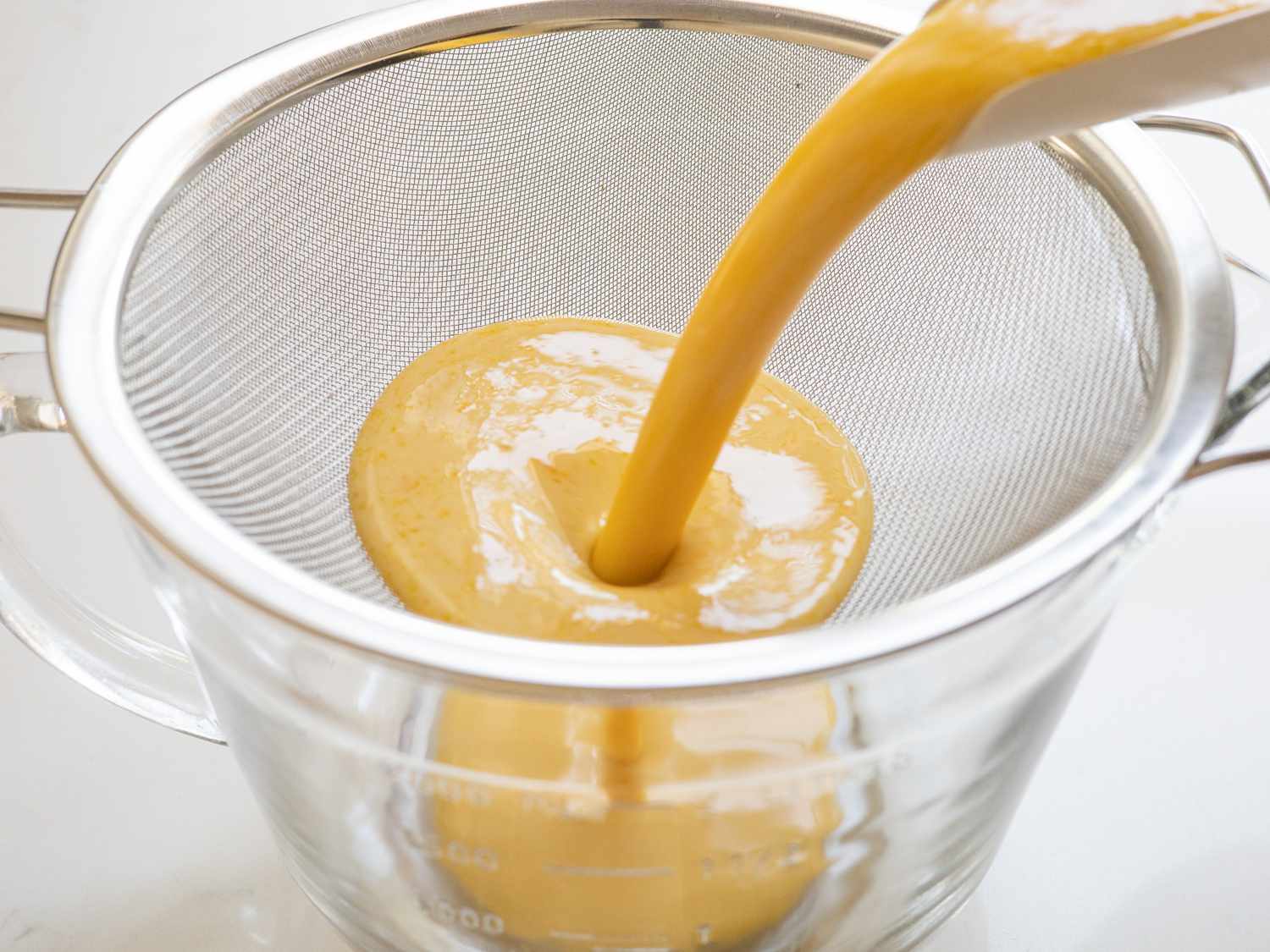 straining custard mixture