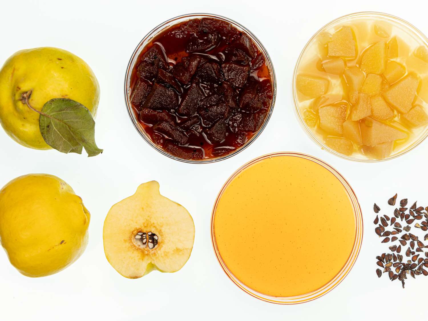 Ingredients for khoresh e beh displayed including quinces cooked and fresh ingredients