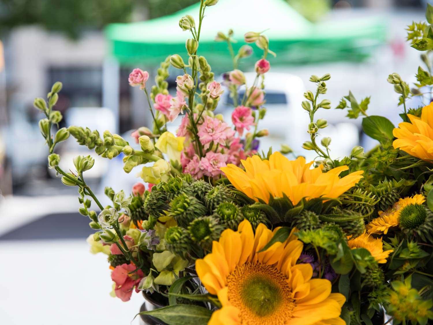 A bouquet of flowers at Willow Wisp Organic Farm farmers market stand