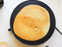 A cooked crepe on the Proctor Silex electric crepe machine.