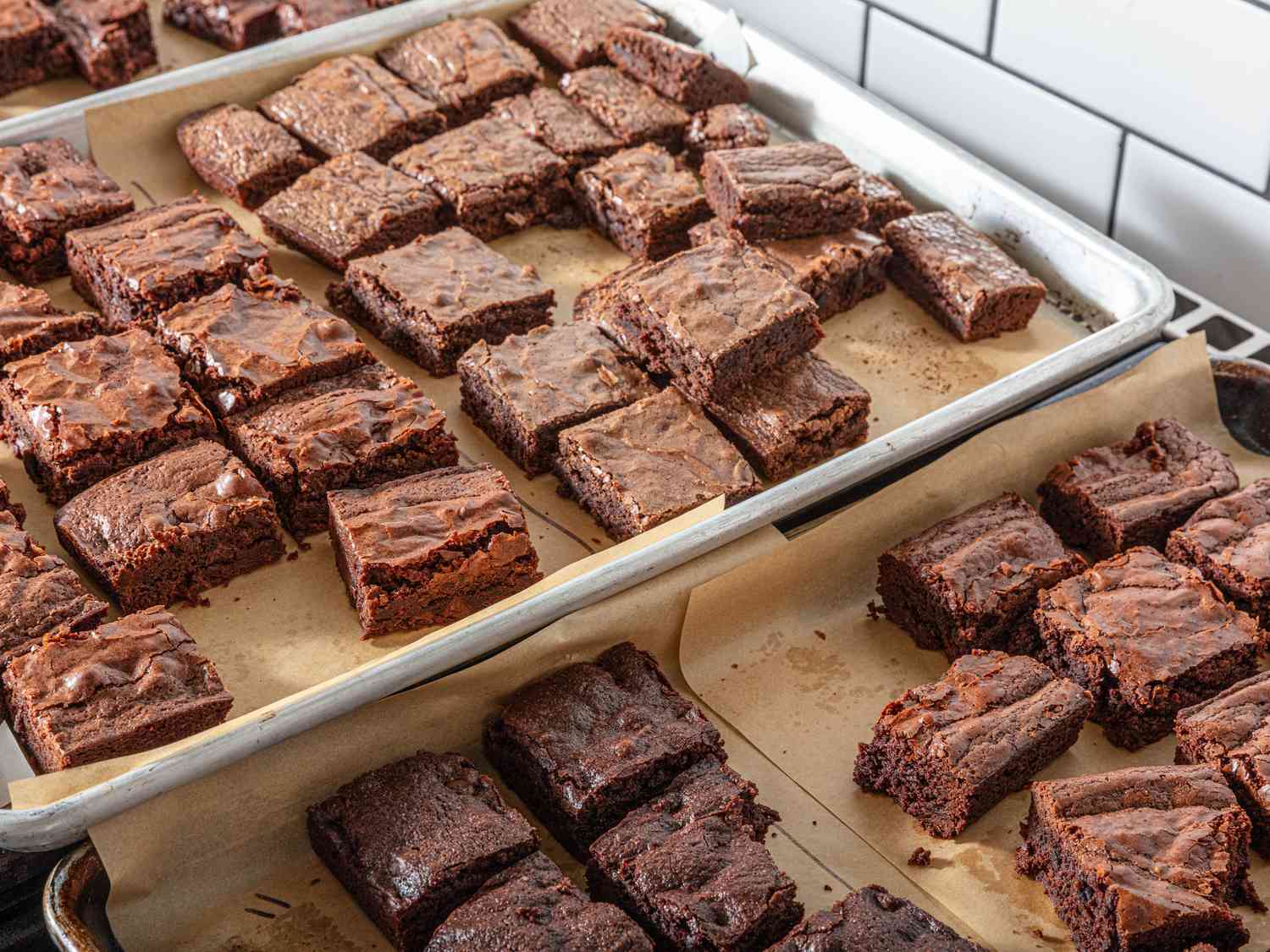 different baked brownie squares on sheet pans 