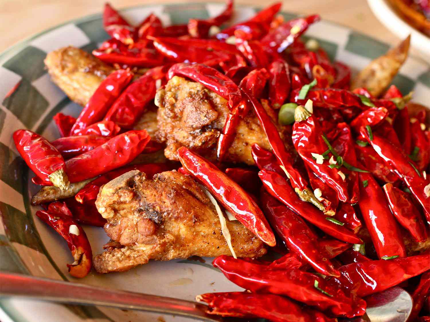 Fried chicken wings loaded with red chiles from Mission Chinese Food