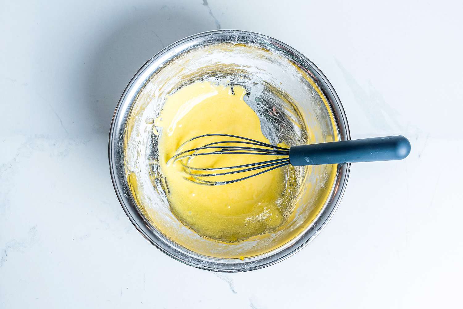 GreenPan Silicone Whisk in a bowl