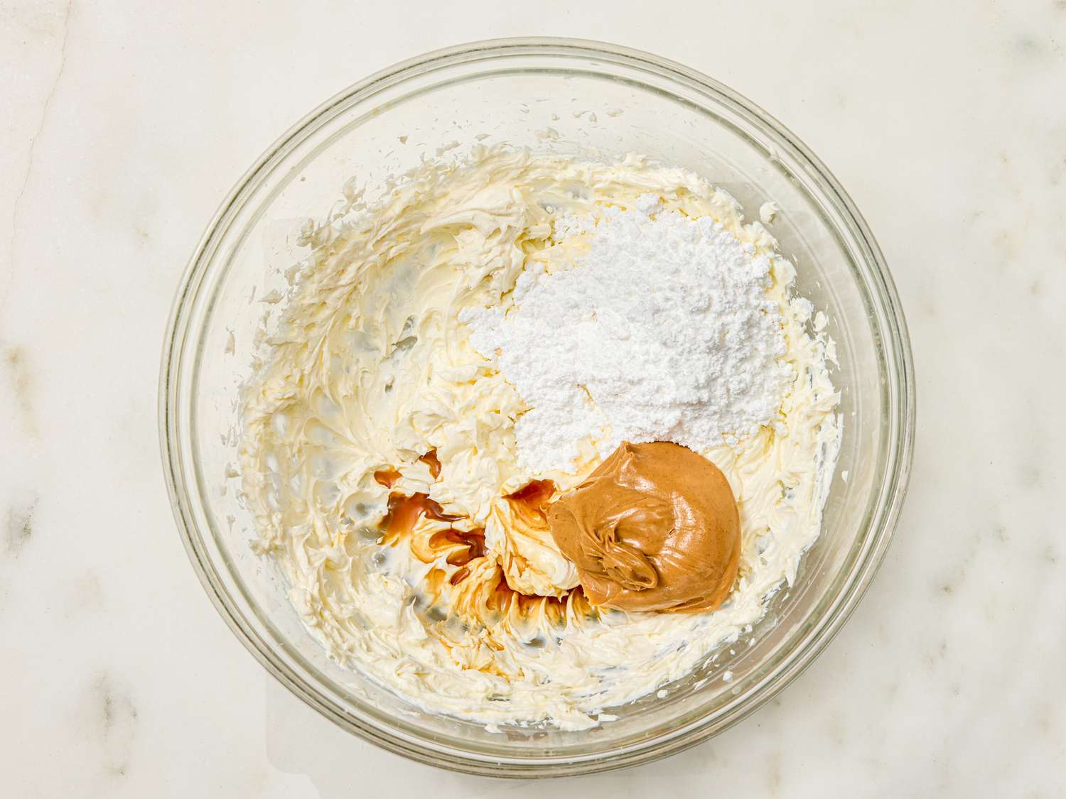 Bowl with cream sugar and peanut butter being mixed