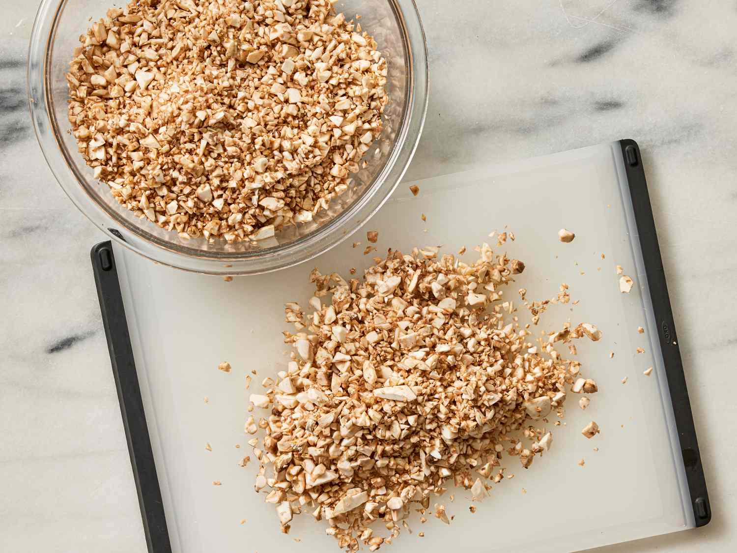 Overhead view of chopping mushrooms