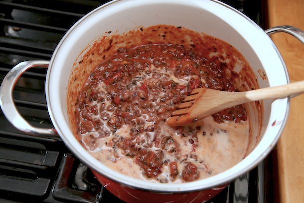 Almond milk and soy sauce are stirred into the sauce.