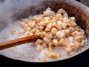 Rendering pork fat to make lard.