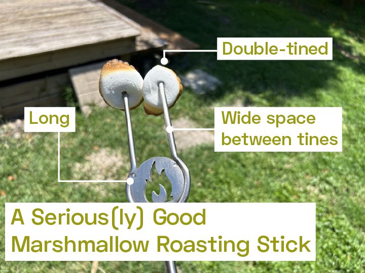 A marshmallow roasting stick with two toasted marshmallows on it.