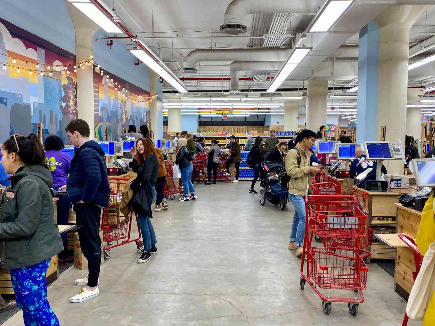 a busy supermarket checkout area