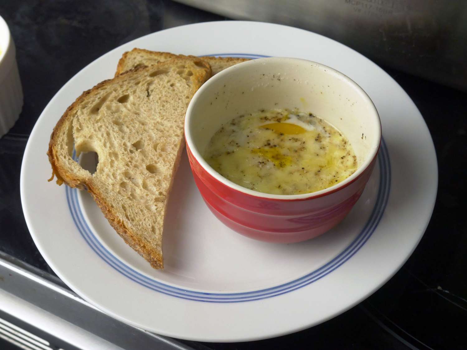 staub ramekin with baked egg and toast