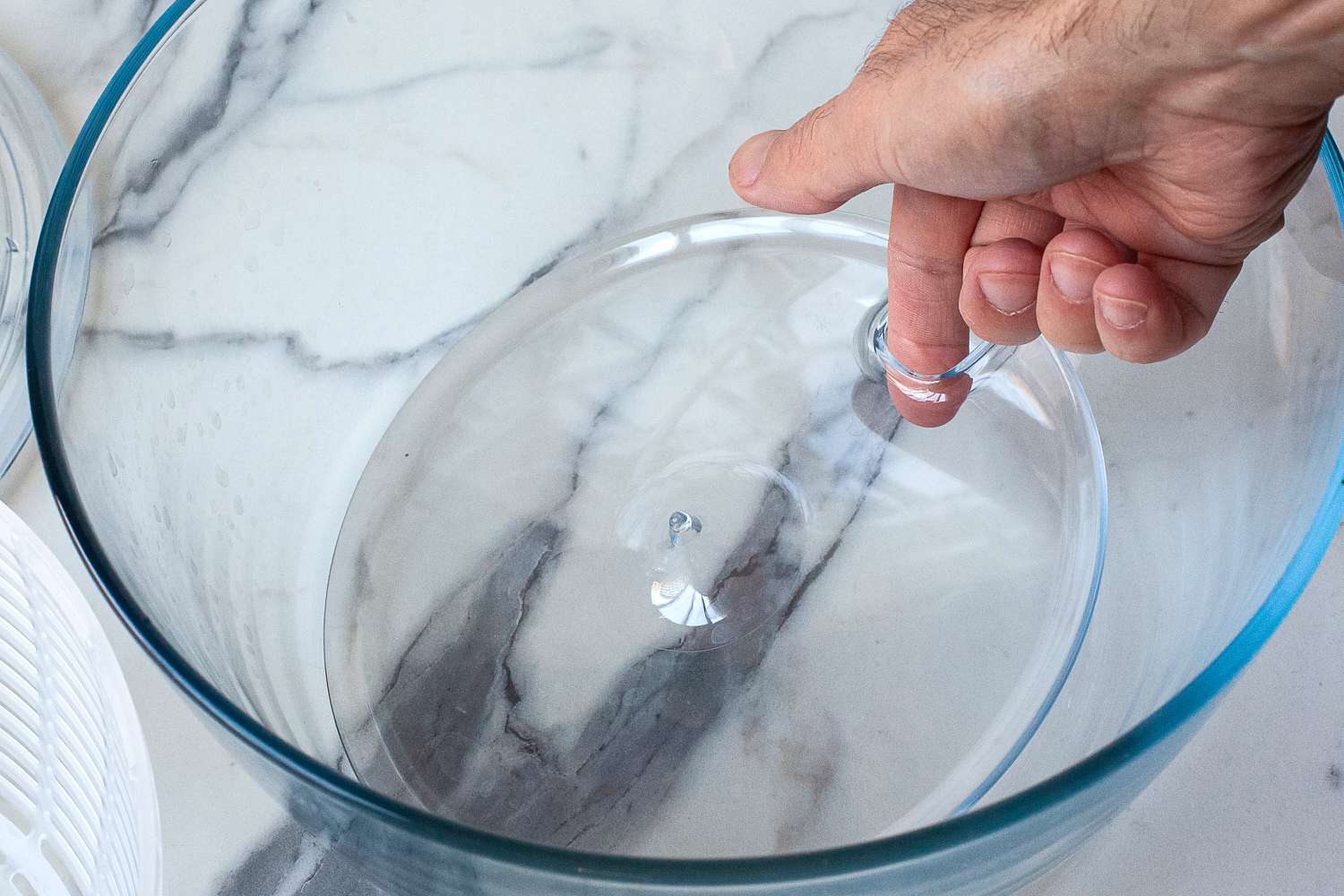 a draining hole in a salad spinner