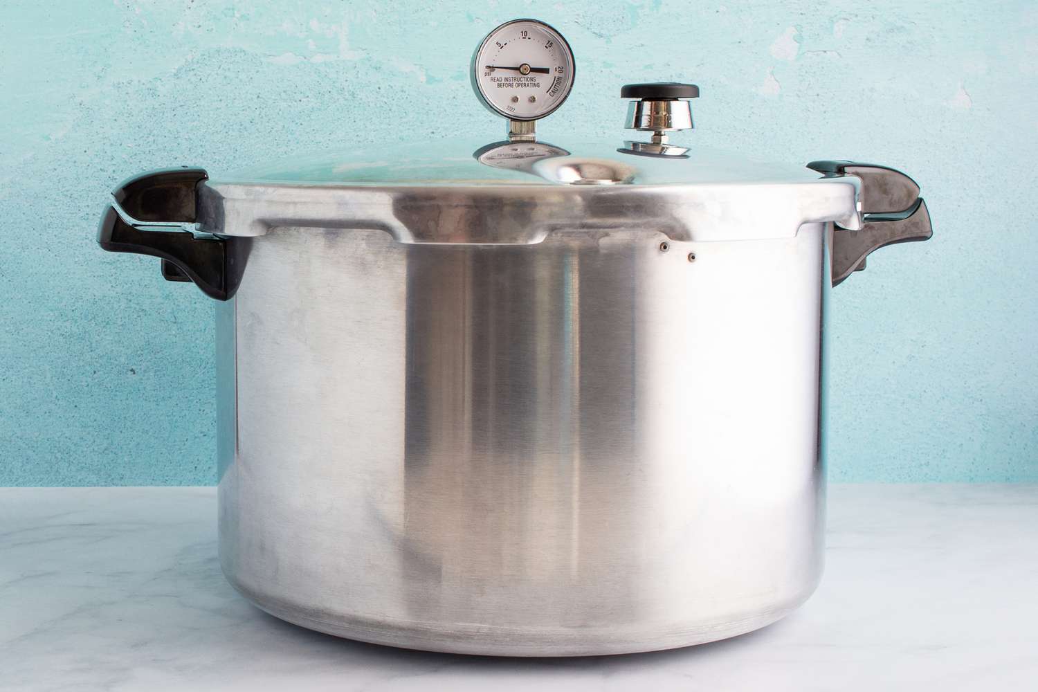 Presto 16-Quart Pressure Canner and Cooker On a counter 