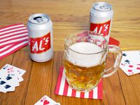 a glass of Al's lager on a wooden surface