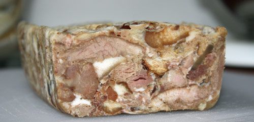 A loaf of headcheese made from a whole pig's head