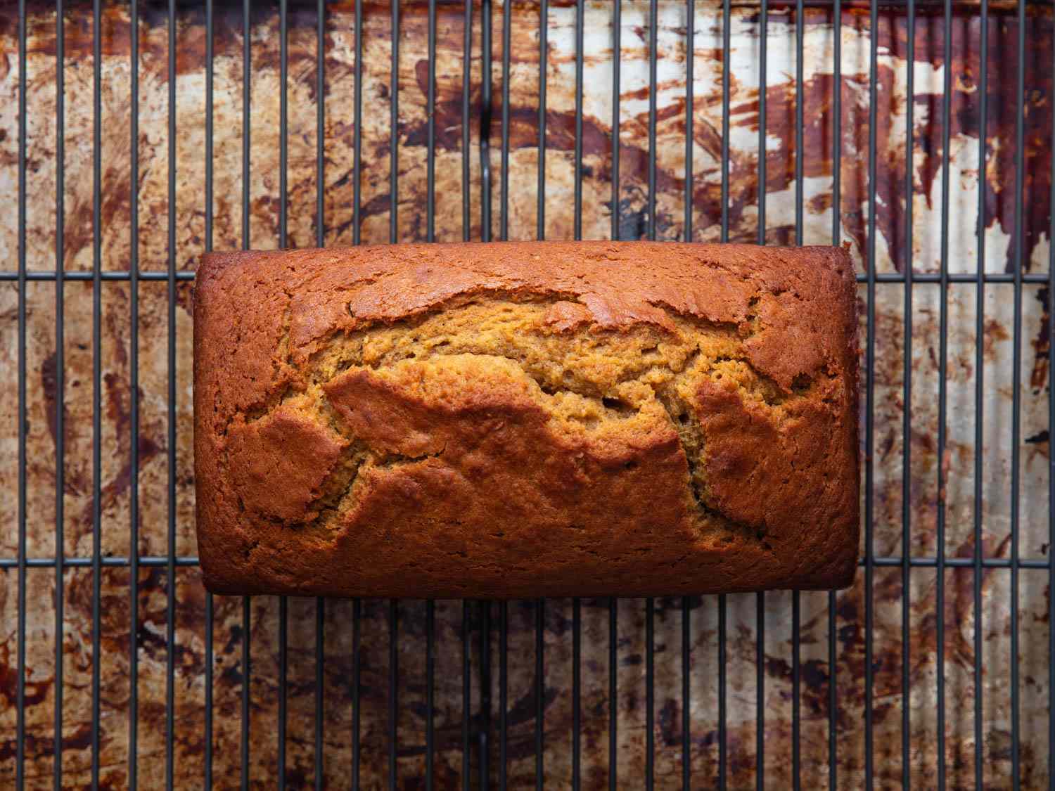 Finished pumpkin loaf on a wire rack.