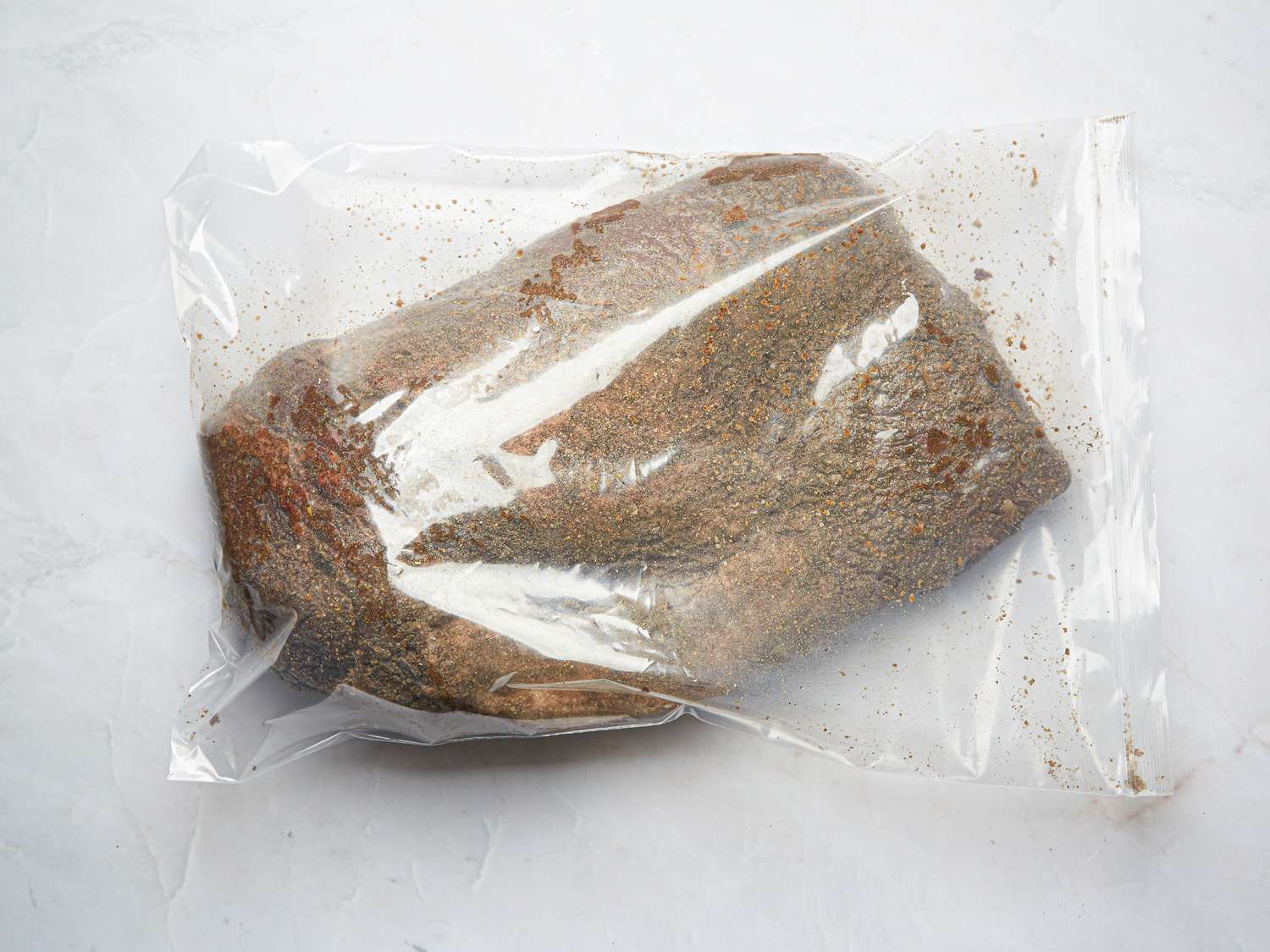 Overhead view of meat in curing bag