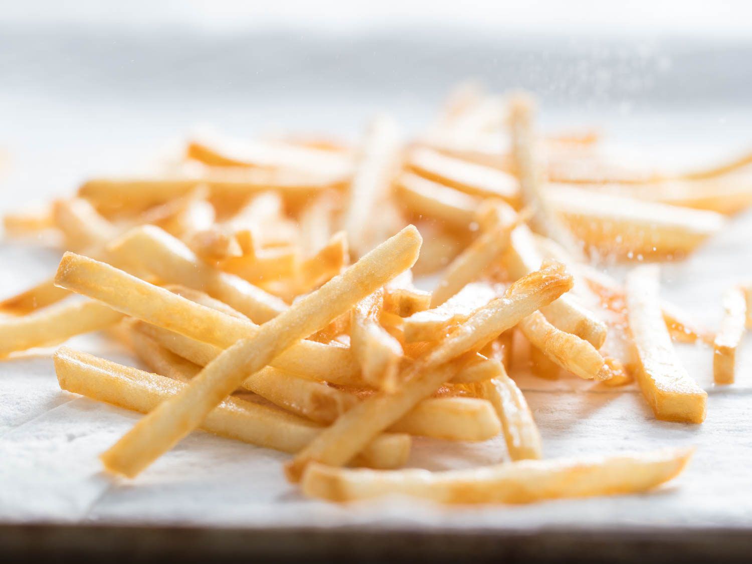 A tray of golden, crispy French fries.