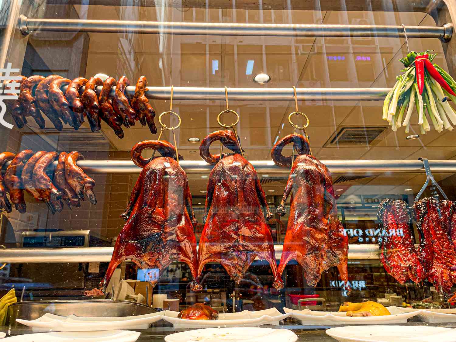 Cooked geese hanging in a window in Hong Kong