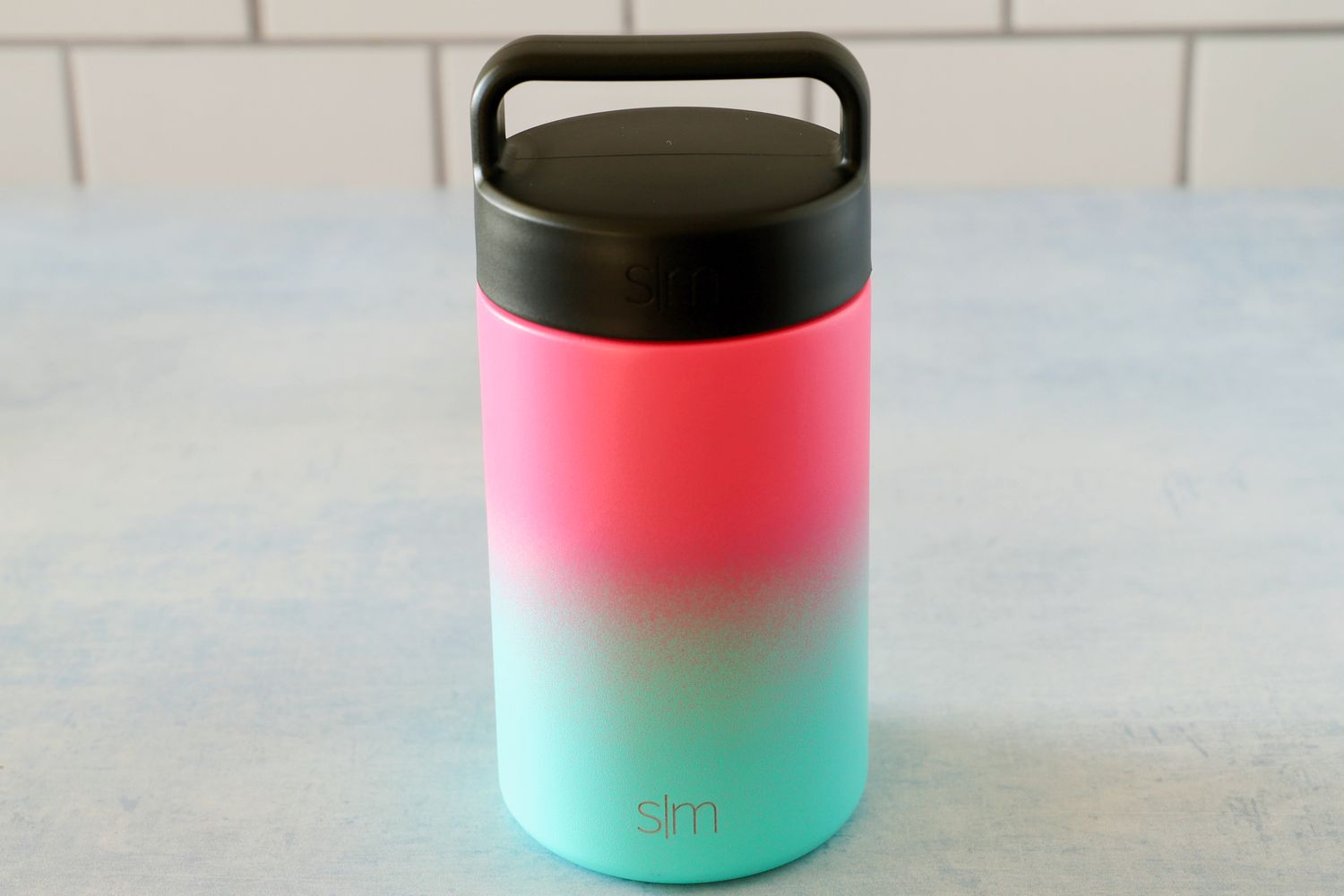 simple modern food thermos on a blue background